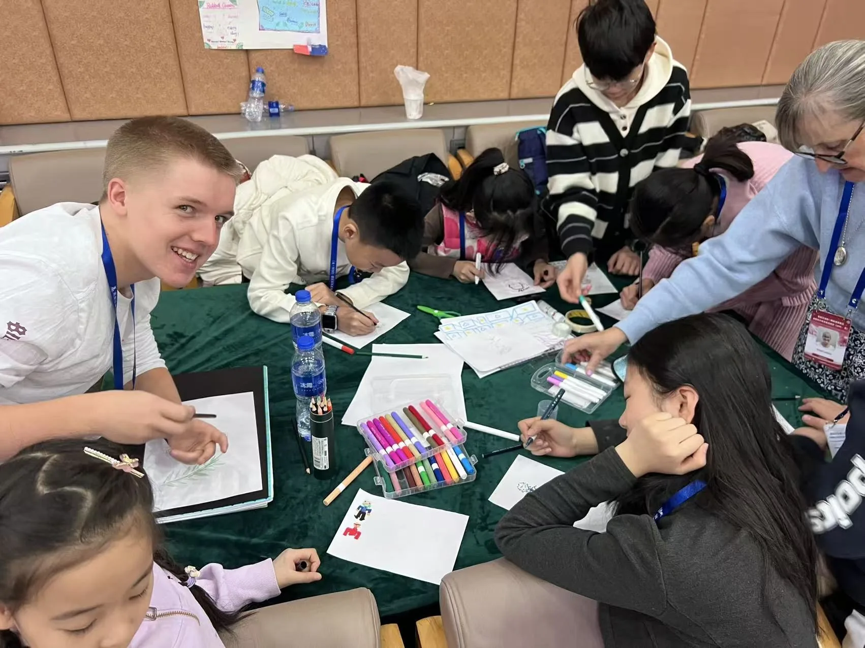 Buddy and students working together