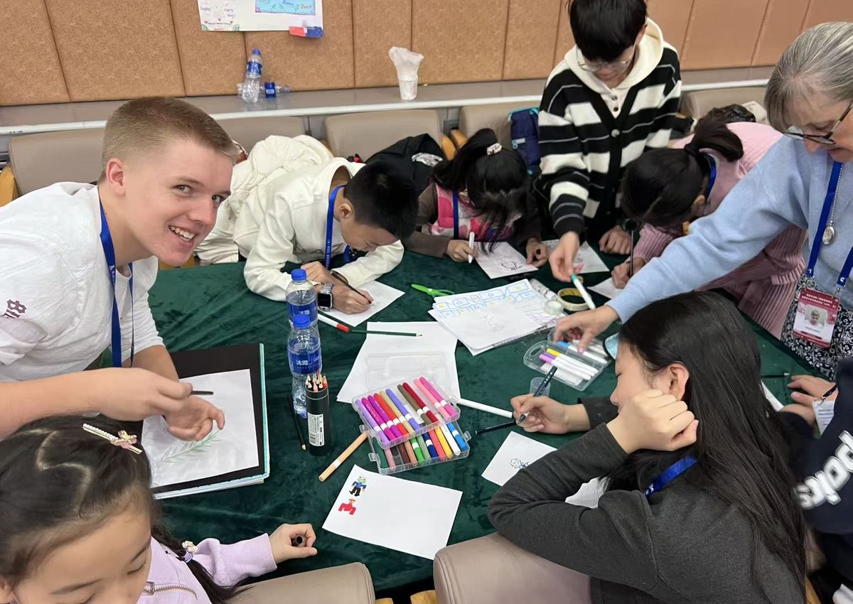 Students and international buddies collaborating in class